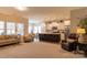Spacious living area showcasing an open floor plan, connecting to the kitchen and dining area at 3156 Pinehills Way, Mount Holly, NC 28120