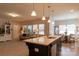 An open floor plan shows the seamless connection between living room and kitchen at 3156 Pinehills Way, Mount Holly, NC 28120