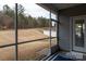The view from the screen porch showcases the private backyard at 3156 Pinehills Way, Mount Holly, NC 28120