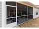 View of screened porch featuring decor, fan, and views of surrounding yard at 3156 Pinehills Way, Mount Holly, NC 28120