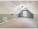 Spacious attic bonus room with high ceilings, fan and natural light from window at 340 Tradewinds Ln, York, SC 29745