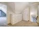 Carpeted attic space with built-in dresser for storage, closet, and access to other rooms at 340 Tradewinds Ln, York, SC 29745