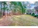 View of the home with its detached garage on a large lawn at 340 Tradewinds Ln, York, SC 29745