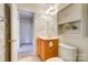 Bright bathroom featuring a vanity with drawers and a toilet with open entry to another room at 340 Tradewinds Ln, York, SC 29745