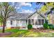 Exterior of home with sunroom, siding, and mature shrubs at 340 Tradewinds Ln, York, SC 29745