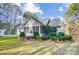 Exterior of the home displaying the sunroom feature, siding, and landscaping at 340 Tradewinds Ln, York, SC 29745