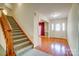 Inviting foyer with hardwood floors, staircase, and decorative front door with sidelights at 340 Tradewinds Ln, York, SC 29745