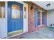 Elegant front door featuring decorative glass and a stylish exterior light fixture with beautiful brick surround at 340 Tradewinds Ln, York, SC 29745