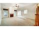 Inviting living area featuring plush carpeting, fireplace, vaulted ceilings, and an abundance of natural light at 340 Tradewinds Ln, York, SC 29745