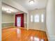 Spacious living area with gleaming hardwood floors, large window, and a welcoming entrance, bathed in natural light at 340 Tradewinds Ln, York, SC 29745