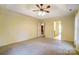 Spacious main bedroom with a ceiling fan, neutral walls, and ample natural light from the window at 340 Tradewinds Ln, York, SC 29745