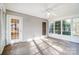 Sunroom with an exit door, multiple windows for natural light, and neutral carpeting at 340 Tradewinds Ln, York, SC 29745