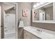 Traditional bathroom features a white vanity and a shower-tub combo at 3419 Wylie Meadow Ln, Charlotte, NC 28269