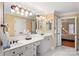 Large bright bathroom with dual sinks and ample counter space at 3419 Wylie Meadow Ln, Charlotte, NC 28269