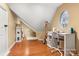 Bedroom featuring wood floors, white desk, decorative window, and ' accessories at 3419 Wylie Meadow Ln, Charlotte, NC 28269
