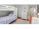 Bright bedroom features bunk beds, a white dresser, and a colorful rug at 3419 Wylie Meadow Ln, Charlotte, NC 28269