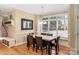 Bright dining area with natural light, hardwood floors, and backyard view at 3419 Wylie Meadow Ln, Charlotte, NC 28269
