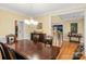 Elegant dining room with a large table and views of the staircase at 3419 Wylie Meadow Ln, Charlotte, NC 28269