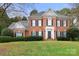 Charming brick two-story home with black shutters and a well-maintained lawn at 3419 Wylie Meadow Ln, Charlotte, NC 28269