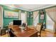 Cozy office featuring built-in bookshelves, a large desk, and natural light at 3419 Wylie Meadow Ln, Charlotte, NC 28269