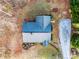 Bird's-eye view of a well-maintained single-story home with a gravel driveway and surrounding landscape at 426 Holland Memorial Church Rd, Bessemer City, NC 28016