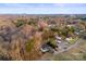 The surrounding community and mature trees are shown in this aerial view at 426 Holland Memorial Church Rd, Bessemer City, NC 28016