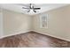 Bedroom featuring a ceiling fan, neutral paint, a window, and wood-look flooring at 426 Holland Memorial Church Rd, Bessemer City, NC 28016