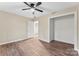 Bedroom featuring a ceiling fan, neutral paint, closet, and wood-look flooring at 426 Holland Memorial Church Rd, Bessemer City, NC 28016
