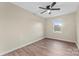 Bedroom featuring a ceiling fan, neutral paint, a window, and wood-look flooring at 426 Holland Memorial Church Rd, Bessemer City, NC 28016