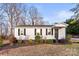 Traditional single-story house with dark shutters and lush bushes adding to the curb appeal at 426 Holland Memorial Church Rd, Bessemer City, NC 28016