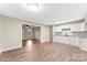 Modern kitchen with white cabinets and a view into the adjacent living room at 426 Holland Memorial Church Rd, Bessemer City, NC 28016