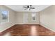 Living area featuring hardwood floors and two windows providing ample natural light at 426 Holland Memorial Church Rd, Bessemer City, NC 28016