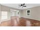 Bright living room with hardwood floors and open doorway to a naturally lit kitchen at 426 Holland Memorial Church Rd, Bessemer City, NC 28016