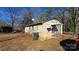 Tan brick home featuring a yard, complemented by mature trees at 509 California Cir, York, SC 29745