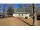 Tan brick home featuring a yard, complemented by mature trees at 509 California Cir, York, SC 29745