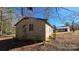 Tan brick home featuring an yard, complemented by mature trees at 509 California Cir, York, SC 29745