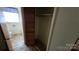 View of a modest bathroom with brown tile flooring and window providing natural light at 509 California Cir, York, SC 29745