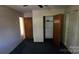 Bedroom features a ceiling fan, closet, neutral walls, carpeted flooring, and a door at 509 California Cir, York, SC 29745