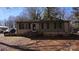 Charming single-story house with brick and green siding, complemented by a well-kept front yard at 509 California Cir, York, SC 29745