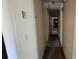 Narrow hallway features plain walls and access to multiple rooms of the house at 509 California Cir, York, SC 29745