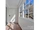 Inviting sunroom with a tiled floor, natural light, and a glass-paneled door at 511 Piedmont Ave, Shelby, NC 28150