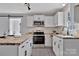 Bright kitchen with white cabinetry, stainless appliances, and butcher block island at 511 Piedmont Ave, Shelby, NC 28150