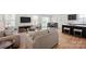 Open living space with wood flooring, a comfortable seating area, and seamlessly connected kitchen at 558 Nesbe St # 2293, Lancaster, SC 29720