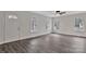 Well-lit living room showcasing wood-look flooring, neutral walls, and a classic ceiling fan for added comfort at 559 Reid St, Kannapolis, NC 28083