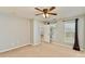 Bedroom with neutral carpet and ceiling fan opens to ensuite bathroom at 618 Bayou Cir, Clover, SC 29710