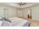 Main bedroom with a tray ceiling, plush carpet, and ensuite bathroom access at 618 Bayou Cir, Clover, SC 29710