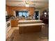 Open kitchen featuring an island with stone counters and wooden cabinets at 708 Mount Olive Church Rd, Newton, NC 28658