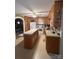 Spacious kitchen featuring wooden cabinets and island, with a refrigerator and gas range at 708 Mount Olive Church Rd, Newton, NC 28658