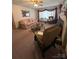 Charming living room with vintage decor, a cozy fireplace, and ample seating at 708 Mount Olive Church Rd, Newton, NC 28658