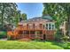 Spacious backyard with a multi-tiered wooden deck offering ample space for outdoor living at 8000 Greencastle Dr, Charlotte, NC 28210